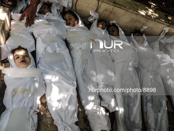 Corpses of children killed by nerve gas after a suspected chemical weapons attack on the Damascus suburb of Ghouta, in August 21, 2013. 

Ph...