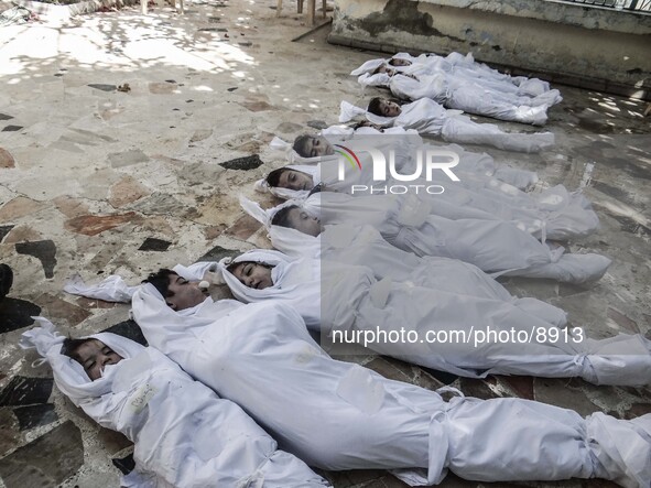 Corpses of children killed by nerve gas after a suspected chemical weapons attack on the Damascus suburb of Ghouta, in August 21, 2013. 

Ph...