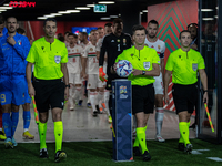 Referee Benoit Bastien pick up the ball before the UEFA Nations League A3 match at Puskás Aréna on Sept 26, 2022 in Budapest, Hungary. (