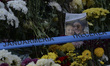 People leave thousands of flowers, candles and messages outside the Colectiv nightclub fir...
