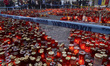 People leave thousands of flowers, candles and messages outside the Colectiv nightclub fir...