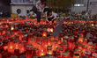 People leave thousands of flowers, candles and messages outside the Colectiv nightclub fir...