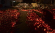 People leave thousands of flowers, candles and messages outside the Colectiv nightclub fir...