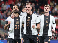 LONDON ENGLAND - SEPTEMBER 26 :Ilkay Gundogan (Manchester City) of Germany celebrates his goal with David Raum of Germany during UEFA Nation...