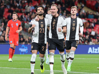 LONDON ENGLAND - SEPTEMBER 26 :Ilkay Gundogan (Manchester City) of Germany celebrates his goal with David Raum of Germany during UEFA Nation...