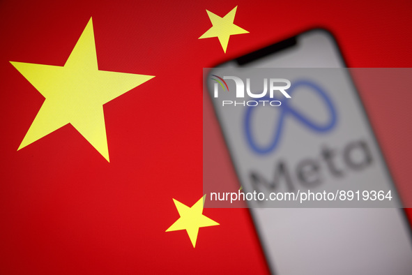 The Meta logo is seen on a mobile phone with the Chinese flag in the background in this photo illustration in Warsaw, Poland on 27 September...