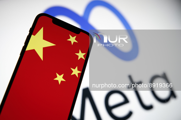 The Chinese flag is seen on a mobile phone with the Meta logo in the background in this photo illustration in Warsaw, Poland on 27 September...