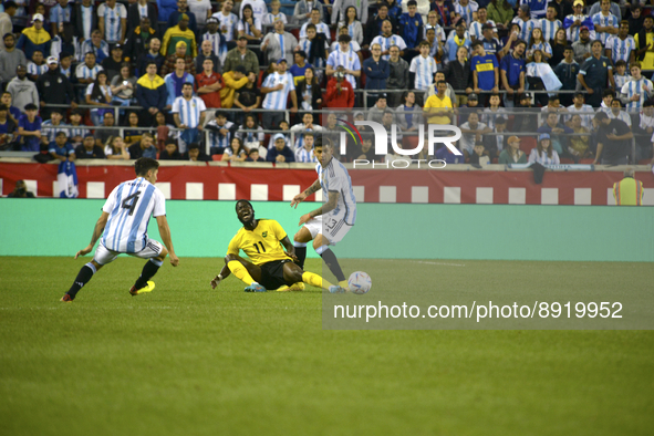 Angel Di maria #11 of Argentina fights for the ball against players from Jamaica in a friendly match at Red Bull Arena on September 27, 2022...