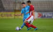 Israel national soccer team player Omri Altman (L) vies for the ball with Malta’s Jean...