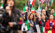 Thousands of people attend a protest for Mahsa Amini, freedom in Iran, and solidarity with...