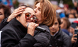 A protester comforts Rana Mansour at she sings at a protest for Mahsa Amini, freedom in Ir...