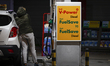 A woman is seen fueling tanking her car at a Shell gas station in Warsaw, Poland on 03 Oct...