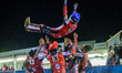 Robert Lambert is given the bumps by his team mates after his 15 point maximum on his debu...