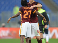 Gervinho celebrates with Edin Dzeko after the Italian Serie A football match A.S. Roma vs S.S. Lazio at the Olympic Stadium in Rome, on nove...