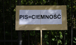 A sign reading 'PiS is darkness' is seen near tthe Chancellery of the Prime Minister to pr...