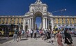 People are seen walking around the Arco Da Augusta monument in the Baixa district, Lisbon....