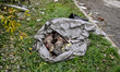ZAPORIZHZHIA, UKRAINE - OCTOBER 10, 2022 -  A human corpse is seen in a plastic bag on the...