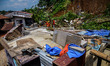 Indonesian Rescuer search for victims of landslides that swept away homes due heavy rainfa...