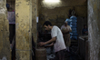 Cairo, Egypt - Mohammed 37 years working in the workshop of dyeing clothes and cottonWorki...
