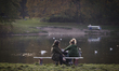 People are seen enjoying the warm weather in the Park Skaryszewski in Warsaw, Poland on 21...