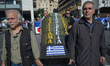 Protesters march towards the Greek Parliament in central Athens during a general strike ag...