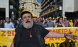 Protesters march towards the Greek Parliament in central Athens during a general strike ag...