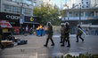 Protesters clash with riot police in central Athens during a general strike against auster...