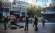 Protesters clash with riot police in central Athens during a general strike against auster...