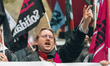A SOLIDAIRE union protester holds up two fingers in the air in victory during a demonstrat...