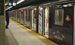 Man stands outside a subway train at Finch Subway Station in Toronto, Ontario, Canada, on...