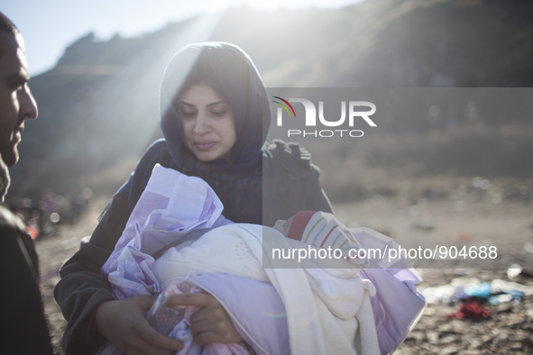 A woman from Syria embraces her son as refugees and migrants riding a dinghy reach the shores of the Greek island of Lesbos after crossing t...