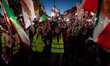 Demonstrators hold their phone lights high as they sing "Soroode Zan" during a march in su...