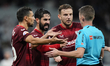 Sevilla players protest to referee during the La Liga Santander match between Real Madrid...