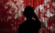 A visitor looks on an artwork by Japanese artist Chiharu Shiota on display at the Bangkok...