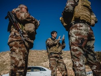 Members of the Iraqi autonomous Kurdish region's peshmerga forces arrive to inspect the liberated city of Sinjar, on November 14, 2015. Iraq...
