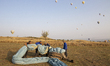 Hot air balloon workers close the balloon in Cappadocia on October 19, 2022, Goreme, Turke...