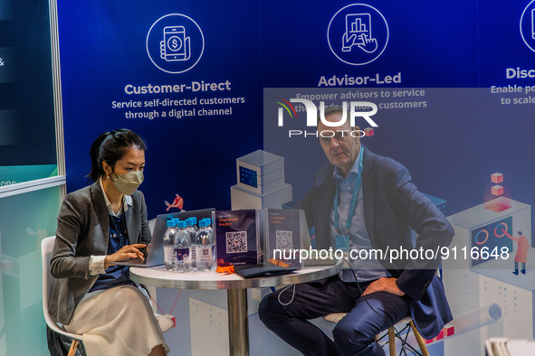 John Robson, Chief Commercial Officer of Quantifeed, a wealth management solutions company is seen on a stand of his company during the Fint...