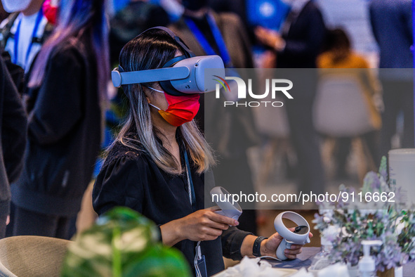 A participant to the Fintech Week tests virtual reality on the Meta stand, in Hong Kong, on November 01, 2022. 