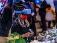 A participant to the Fintech Week tests virtual reality on the Meta stand, in Hong Kong, on November 01, 2022. (