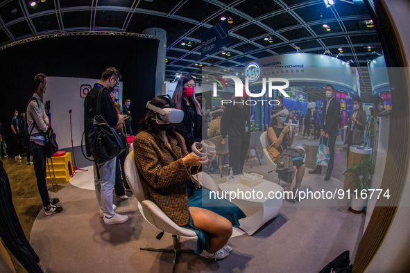 People experience the metaverse via virtual reality headsets on the stand of Meta at the Hong Kong Fintech Week,in Hong Kong, on November 01...