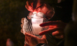 People light a candle at the Rakowicki Cemetery in Krakow.On November 1, All Saints' Day,...
