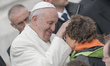 Pope Francis addresses the crowd during his weekly general audience in St Peter's square o...