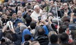 Pope Francis addresses the crowd during his weekly general audience in St Peter's square o...