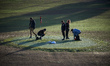 Activists draw the XR symbol on the golf course with balls found on the golf. XR France (E...