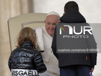 Two children  greeting Pope Francis at the beginning of his weekly general audience in St. Peter's Square at The Vatican, Wednesday, Nov. 9,...