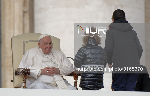 Two children  greeting Pope Francis at the beginning of his weekly general audience in St. Peter's Square at The Vatican, Wednesday, Nov. 9,...