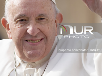 Pope Francis arrives for his weekly general audience in St. Peter's Square at The Vatican, Wednesday, Nov. 9, 2022. (
