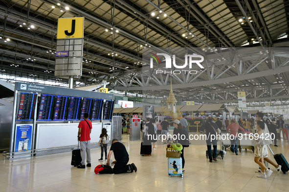 Travels seen inside the departure terminal of the Suvarnabhumi International Airport on November 9, 2022 in Sumut Prakan, Thailand. 