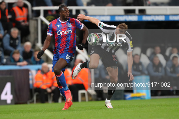 Dan Burn of Newcastle United battles for possession with Crystal Palace's Jean-Philippe Mateta during the Carabao Cup Third Round match betw...
