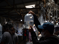 Buyers check goldfish at Parung ornamental fish market in Bogor of West Java province on 12 November 2022. Parung ornamental fish market is...